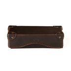 Grandfather Eyeglass Case in Dark Coffee Brown, closed front view with riveted corner caps and embossed logo
