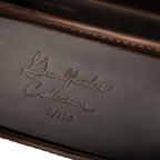 Grandfather Eyeglass Case in Dark Coffee Brown, close-up of embossed Grandfather Collection script and edition number