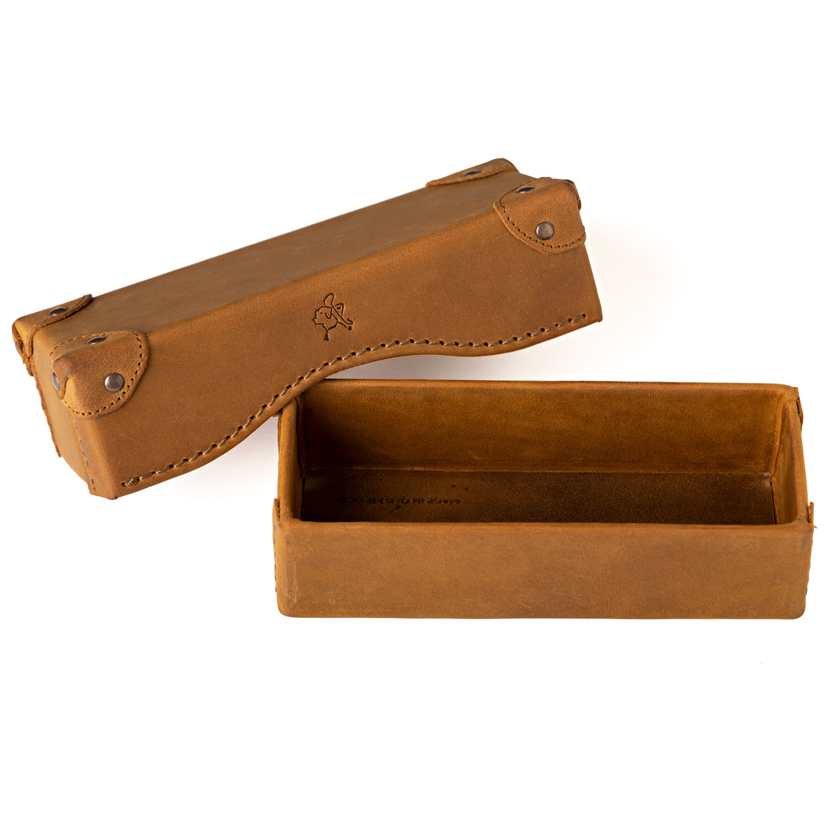 Grandfather Eyeglass Case in Tobacco leather, lid set beside the open base, embossed tortoise on top