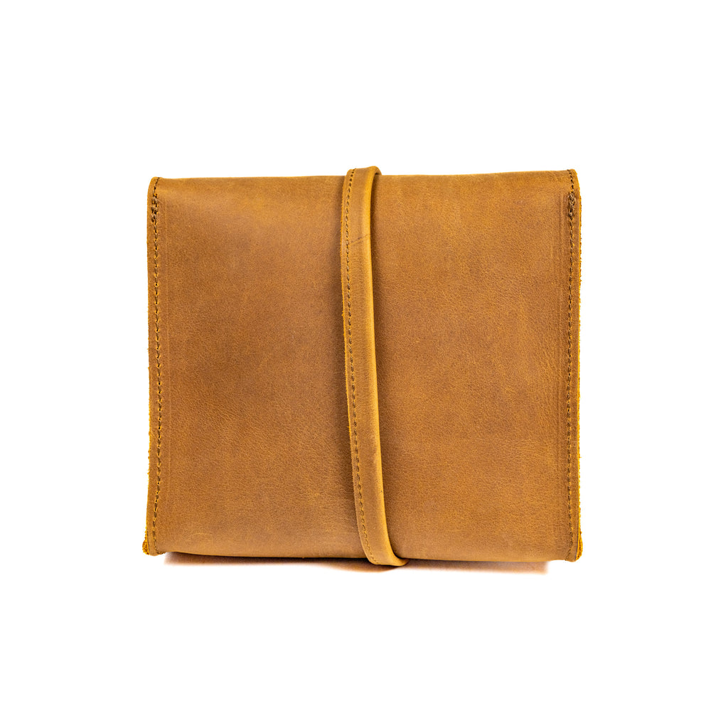 Auto Organizer Set leather organizer bag in Tobacco, front view closed with the leather wrap strap