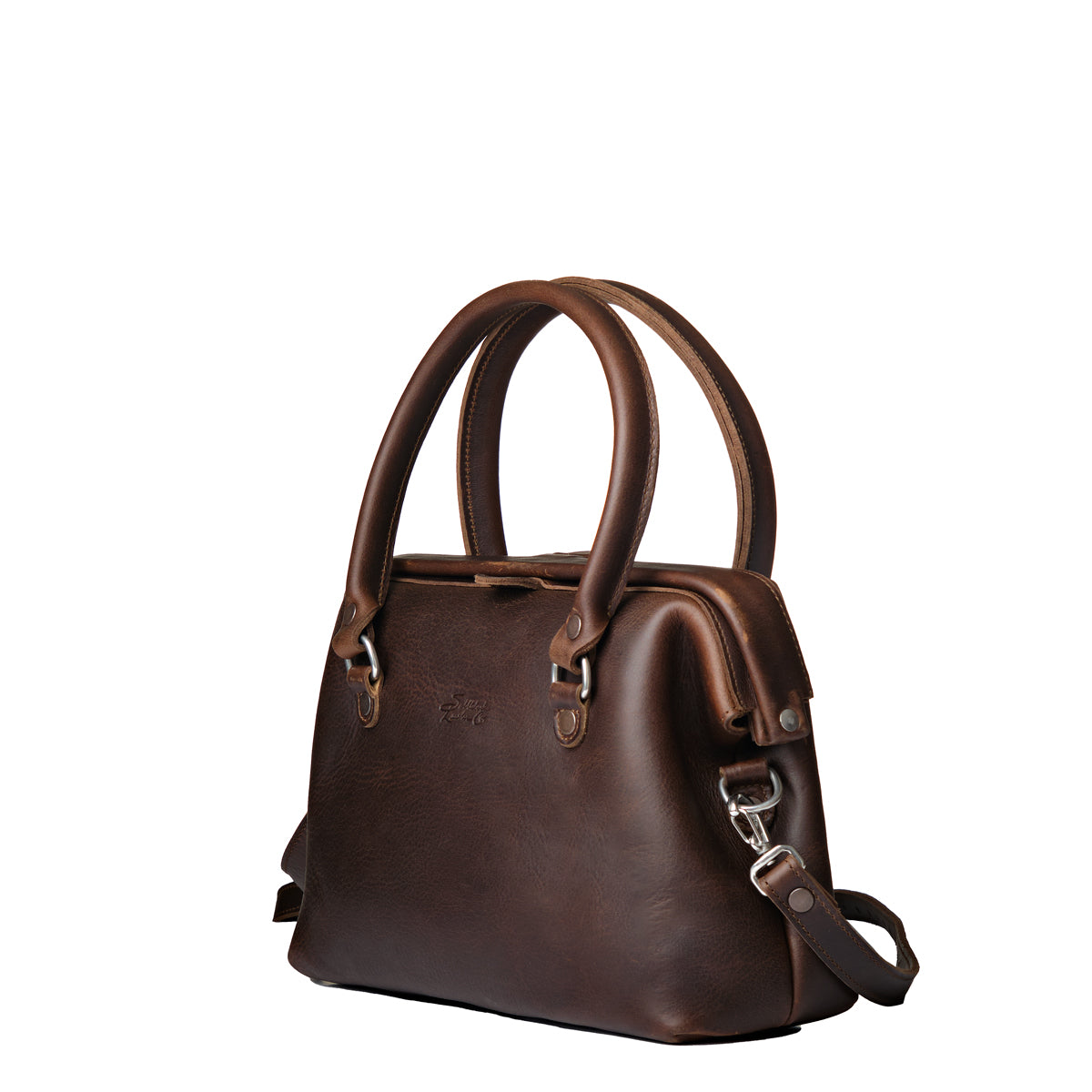 Everyday Purse in Dark Coffee Brown, angled front view with rolled top handles and clipped shoulder strap