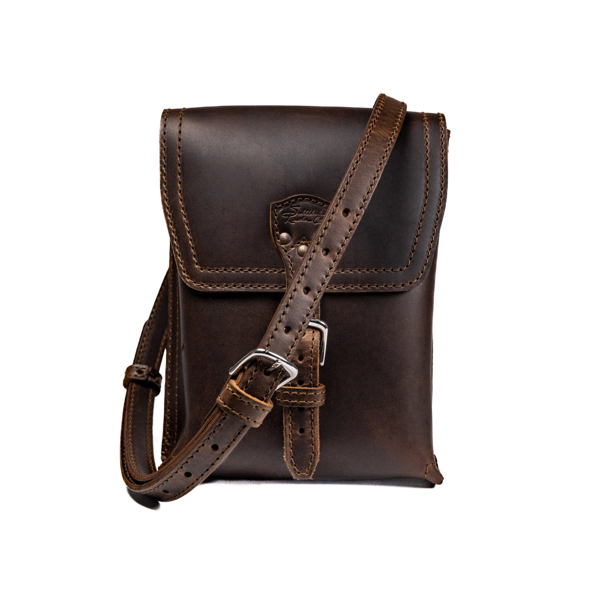 Leather Travel Satchel in Dark Coffee Brown, front view with adjustable shoulder strap draped across the bag
