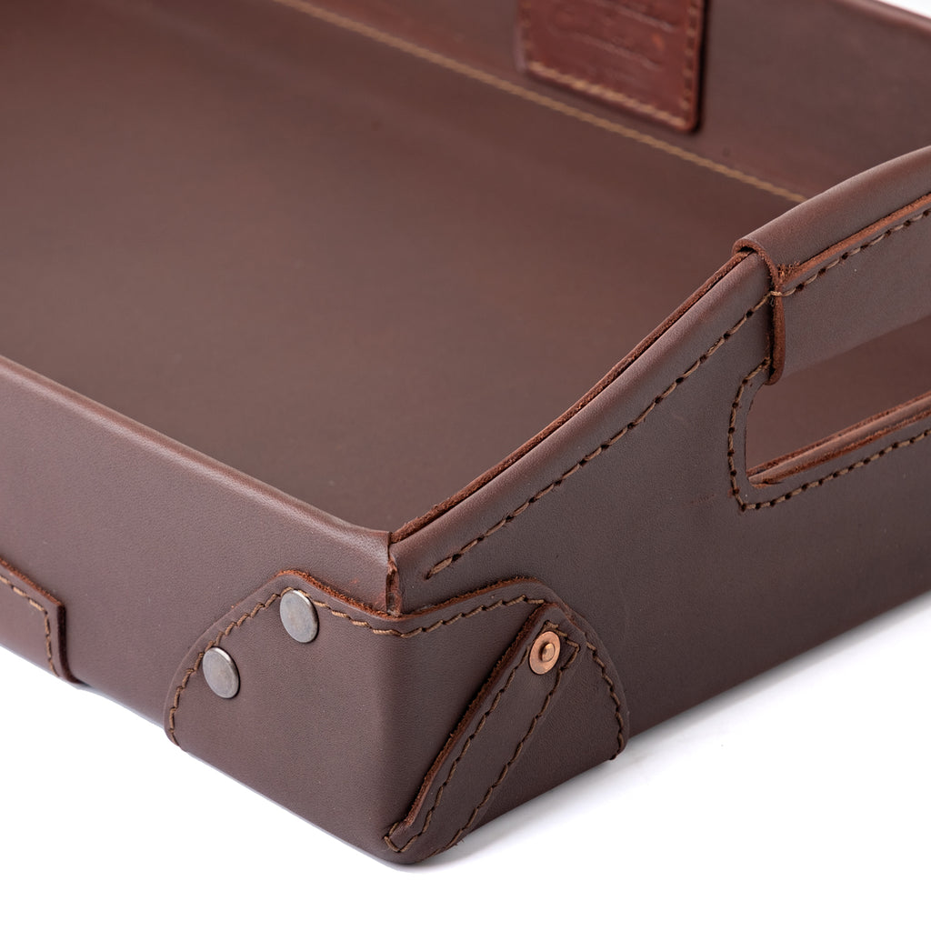 Grandfather Serving Tray in Chestnut leather, close-up of riveted corner, stitching and handle