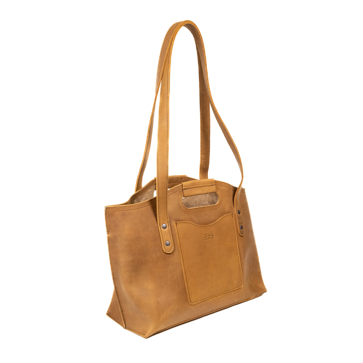 Urban Leather Tote in Tobacco, angled side view with shoulder handles, cutout grip and front slip pocket