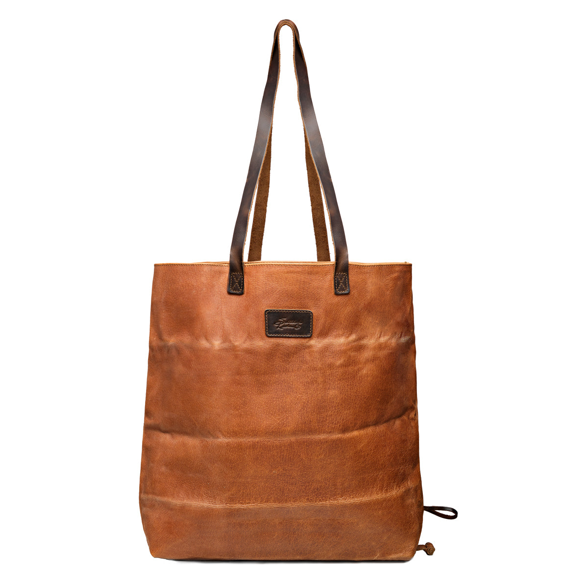 Travel Tote in Bacon, front view with leather logo patch, ridged hogsback leather and dark shoulder handles