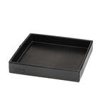 The Simple Leather Valet Tray in Black, empty, angled view showing stitched corner seams and embossed logo