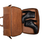 Two Compartment Duffle in Tobacco, bottom shoe compartment opened with a pair of black boots inside