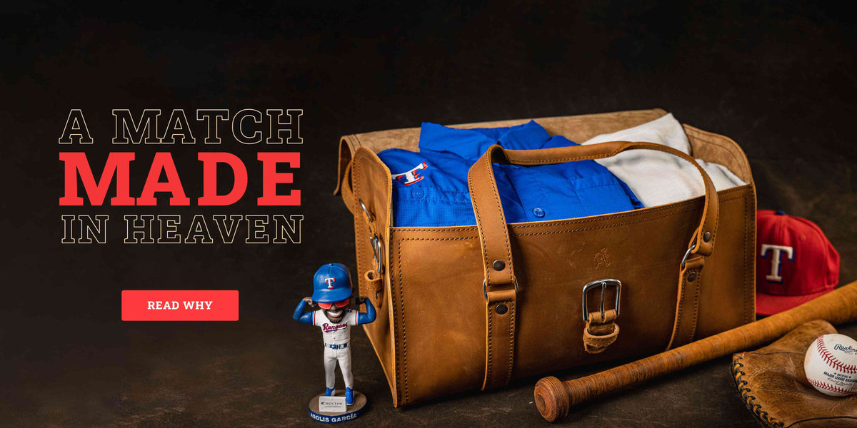 A Match Made in Heaven, read why: a tan leather duffle packed with Rangers jerseys, beside a Rangers cap, a bat, a glove and an Adolis Garcia bobblehead.
