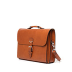 Livingstone Briefcase in English Tan, angled side view showing the buckled flap and shoulder strap clip