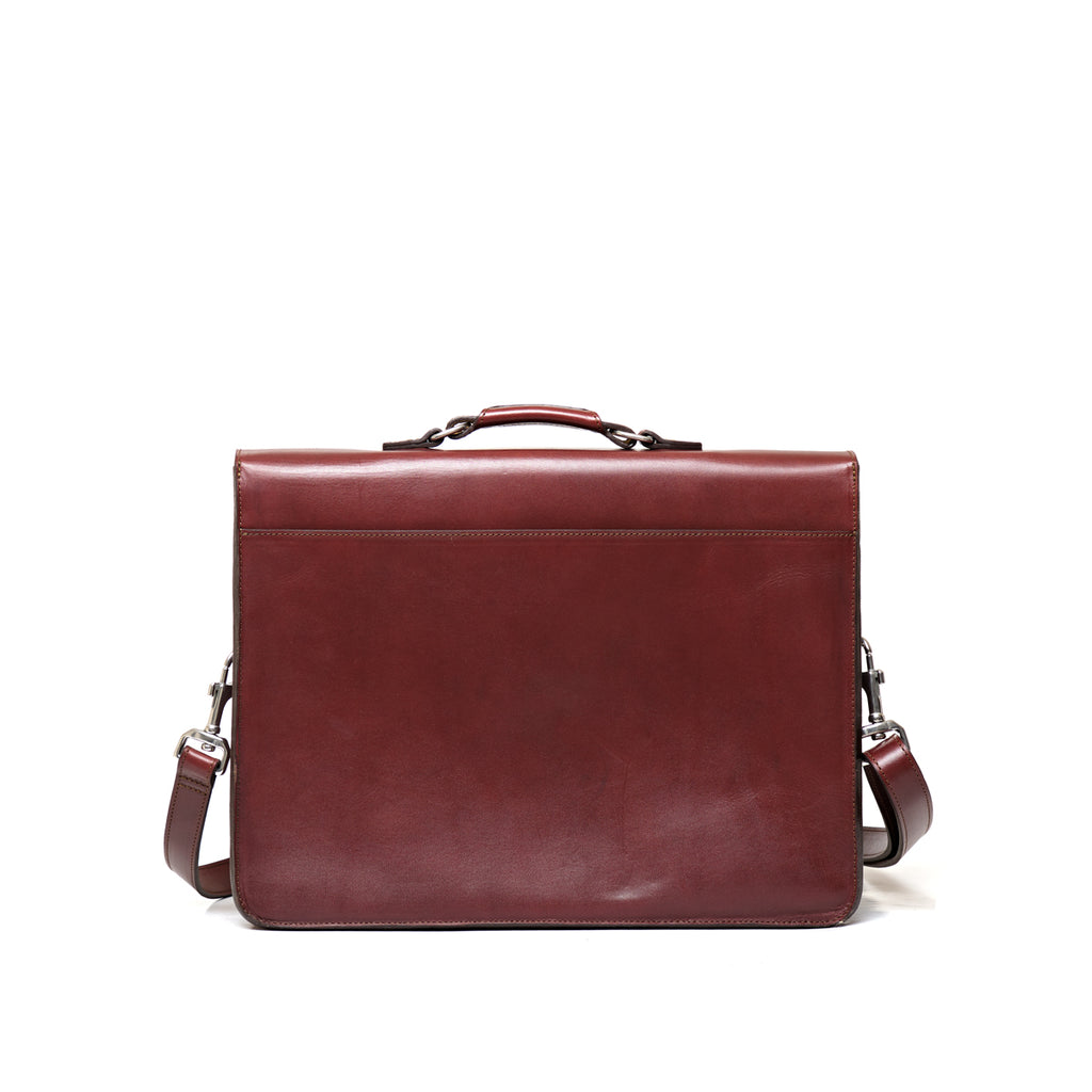 Livingstone Briefcase in Oxblood, back view with top handle and shoulder strap clips