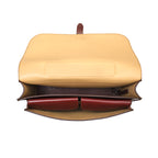 Livingstone Briefcase in Oxblood, top-down view with flap open showing the tan lining and inner pockets