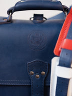 Saddleback Club Membership Paul Revere Leather Messenger Bag Backpack in Red, White and Blue, close-up of 250th anniversary seal
