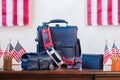 2026 Membership Bundle: high quality navy blue leather bag and accessories with red straps on a table with American flags