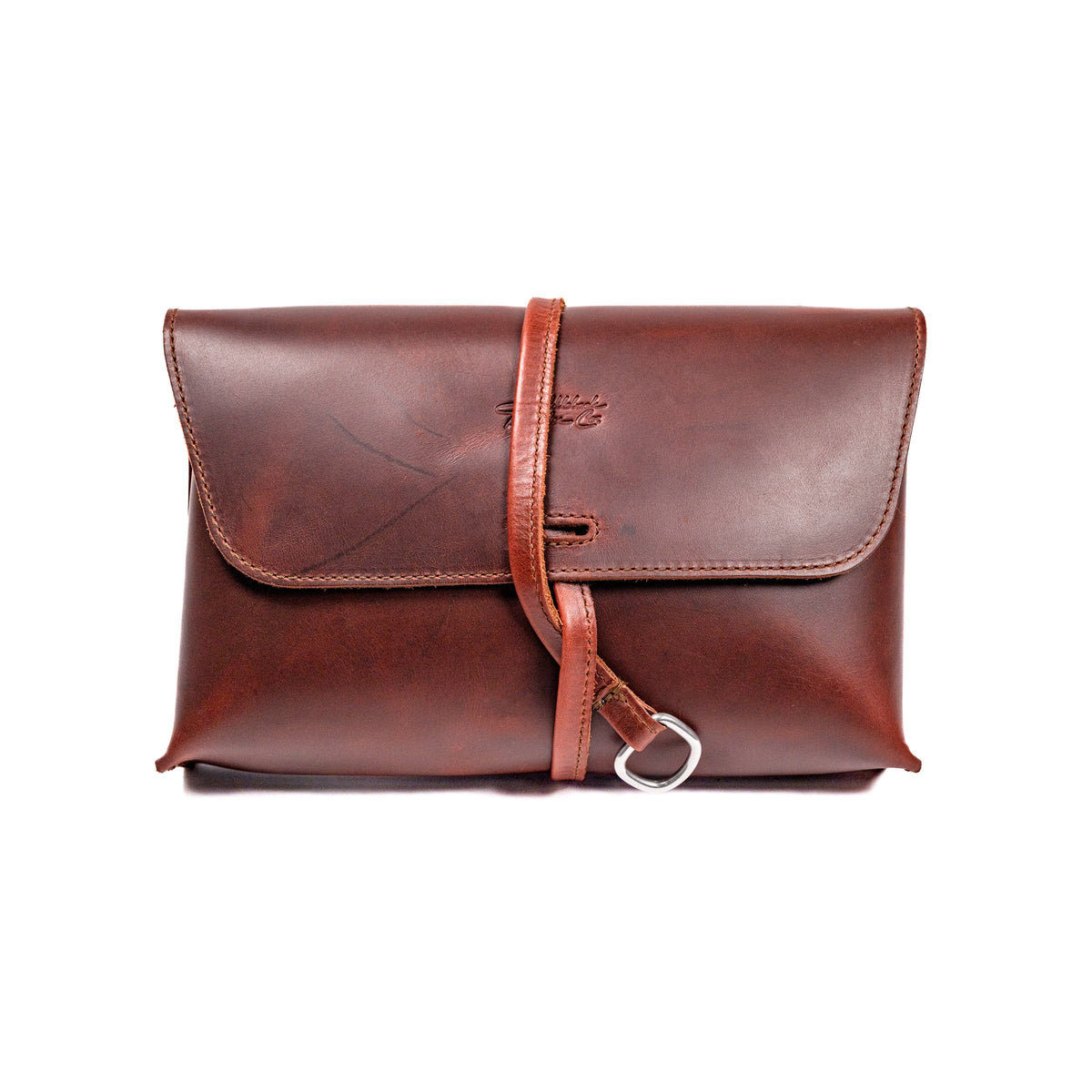 Large Leather Organizer Bag in Chestnut, closed flap with wrapped leather tie and ring, front view