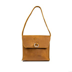 Leather Organizer Bag in Tobacco, front view hanging from its strap with flap and metal ring closure