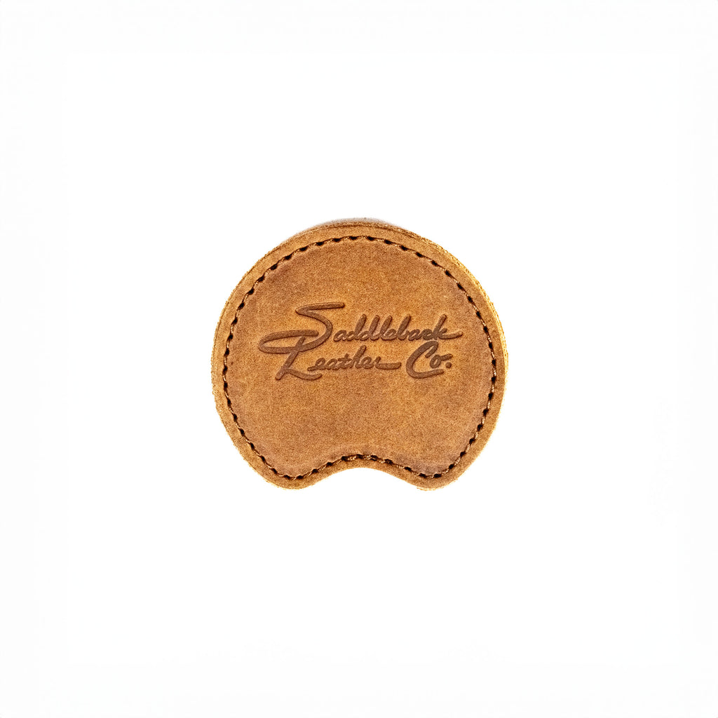 Auto Organizer Set leather cupholder coaster in Tobacco, top view with embossed Saddleback logo