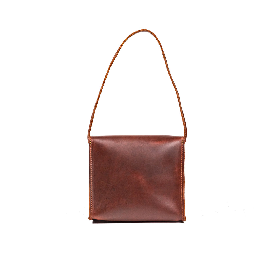 Leather Organizer Bag in Chestnut, back view hanging from its leather strap