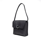 Leather Organizer Bag in Black, angled view hanging from its strap with flap and metal ring closure