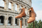 Officer's Boot in English Tan, pair on wooden stands in front of the Colosseum in Rome