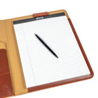 Old Design Medium Leather Portfolio in Chestnut, open with a legal pad and pen, angled close-up