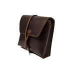 Leather Organizer Bag in Dark Coffee Brown, three-quarter view with flap closure and strap wrapped around the front