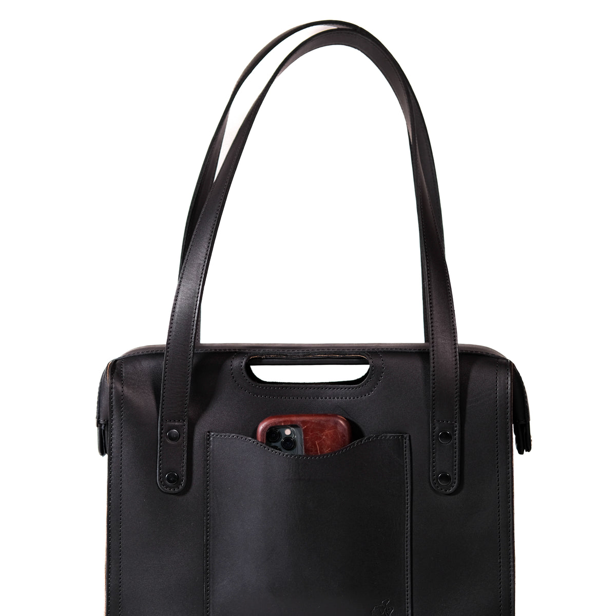 Professional Leather Tote in Black, close-up front view of shoulder handles and a phone in the front pocket