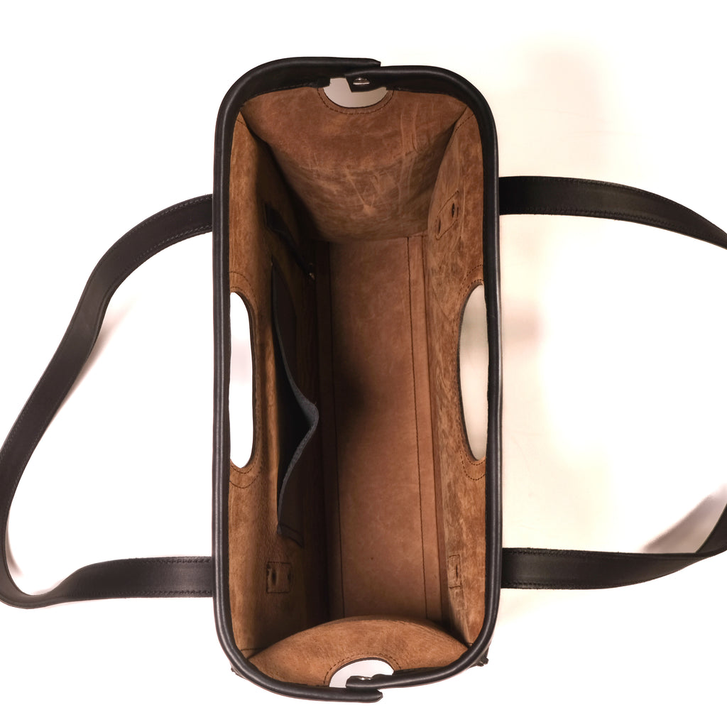 Professional Leather Tote in Black, top view open and empty showing suede lining and interior slip pocket