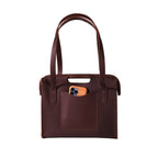 Professional Leather Tote in Chestnut, front view with shoulder handles, cutout grip and a phone in the front pocket