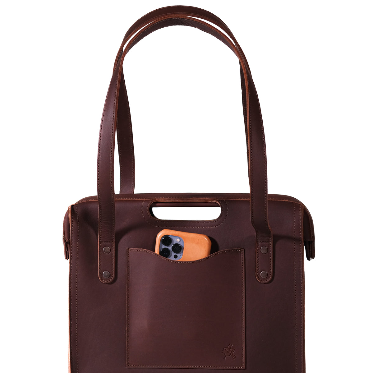 Professional Leather Tote in Chestnut, close-up front view of shoulder handles and a phone in the front pocket