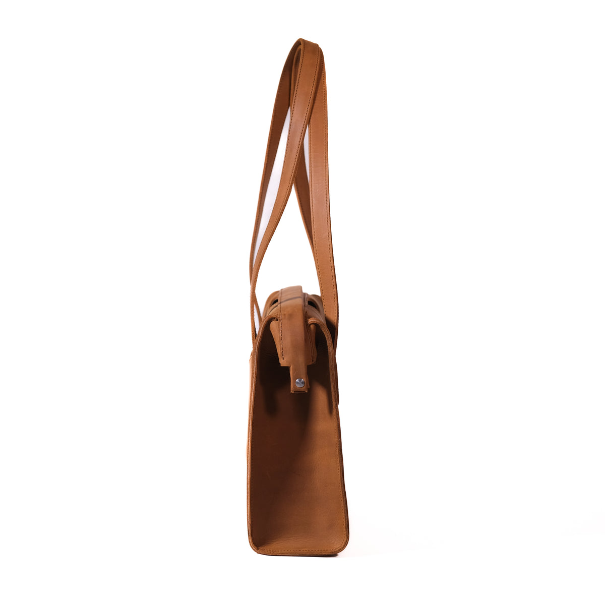 Professional Leather Tote in Tobacco, side profile view showing the slim gusset and shoulder handles