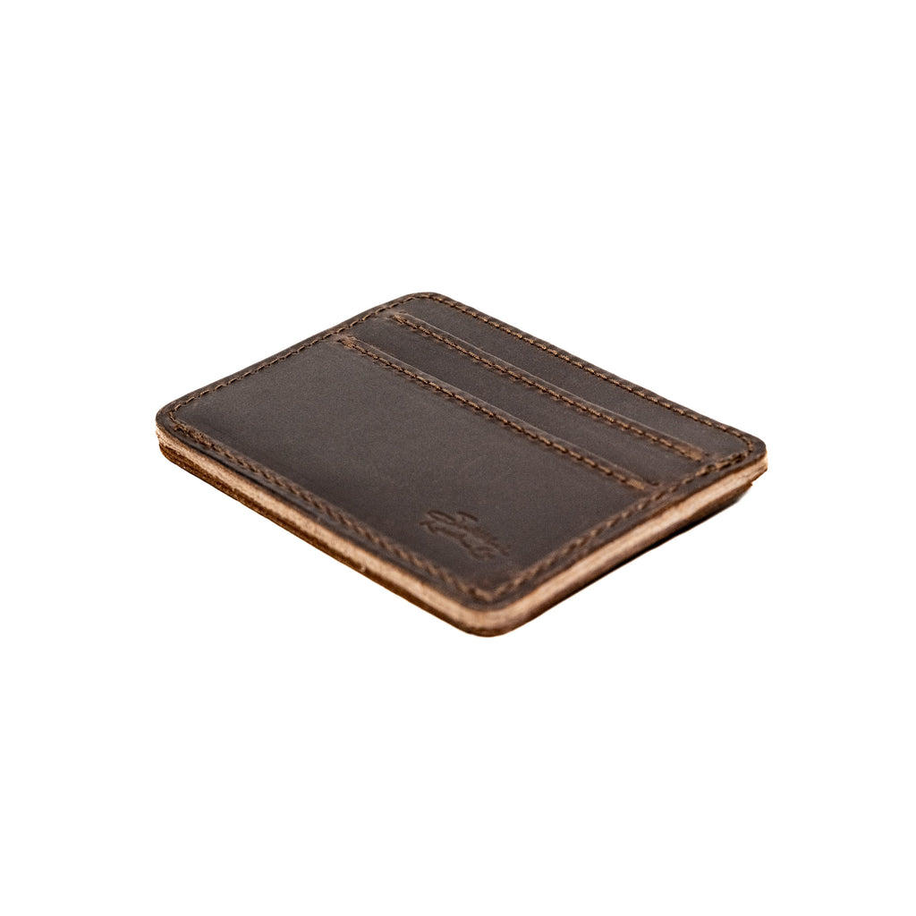 Front Pocket Leather ID Wallet in Dark Coffee Brown lying at an angle to show its thin profile and natural edge