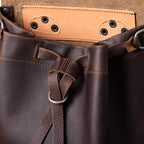 12" Drawstring Backpack in Dark Coffee Brown, close-up of drawstring tie and ring below the open flap