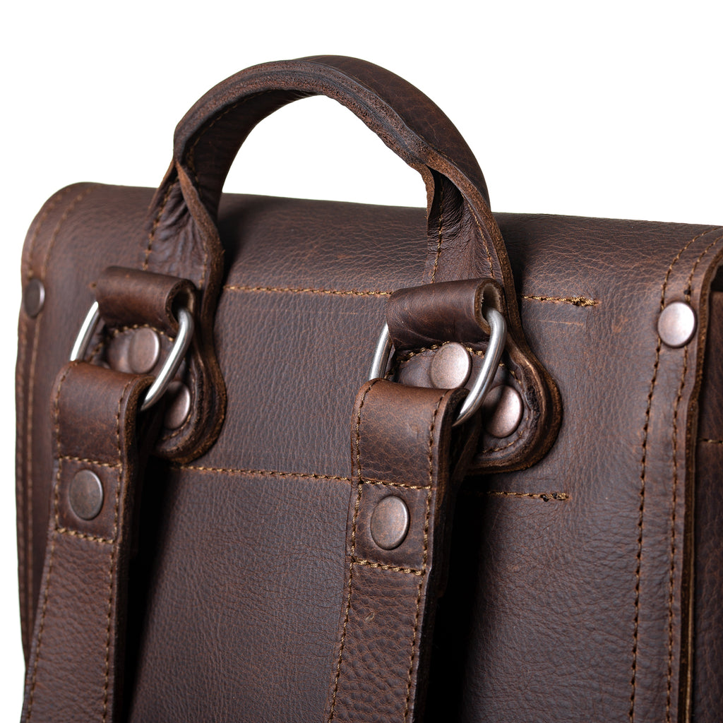 12" Drawstring Backpack in Dark Coffee Brown, close-up of top handle, strap rings and rivets on the back