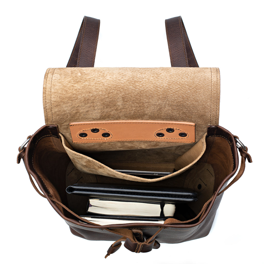 12" Drawstring Backpack in Dark Coffee Brown, top view open with a tablet and books inside