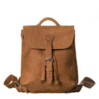 12" Drawstring Backpack in Tobacco, front view with buckled flap and drawstring ties