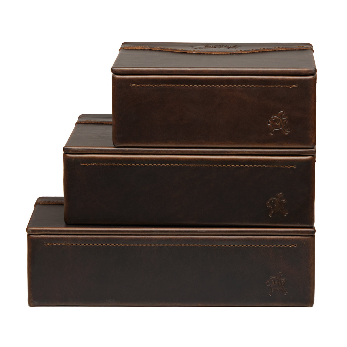 Small Organizer Box in Dark Coffee Brown stacked on two larger matching leather boxes, each with embossed logo