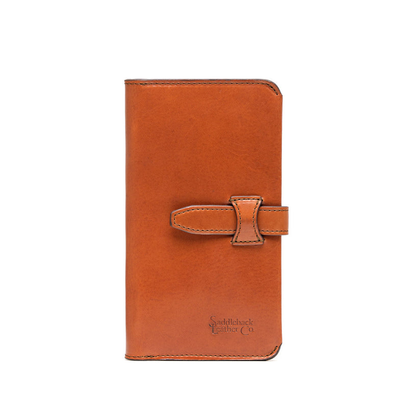 Tall tan leather wallet closed with a horizontal strap and loop across the front.