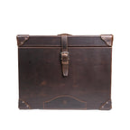 Leather Small Trunk in Dark Coffee Brown, closed front view with buckled strap and corner guards
