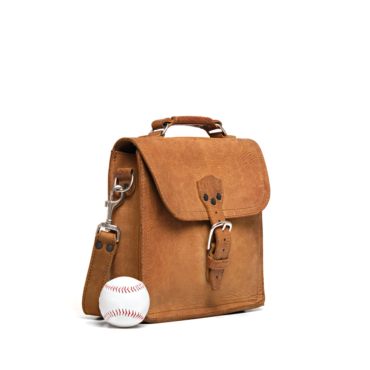 Indiana Leather Satchel in Tobacco, angled front view beside a baseball for size comparison