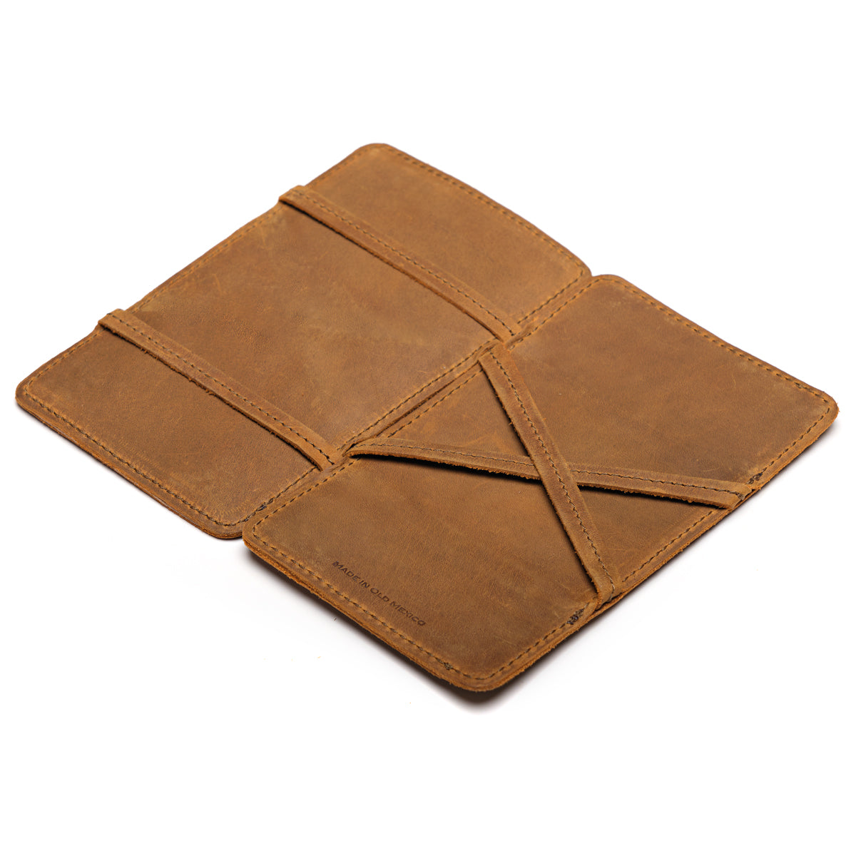 Large Magic Wallet in Tobacco opened flat to show the crossed leather straps inside