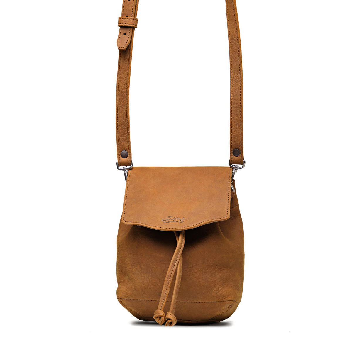 Mini Bucket Bag in Tobacco, front view with flap, drawstring tie and adjustable crossbody strap