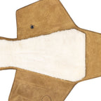 Leather Pistol Wrap in Tobacco laid flat and empty, showing the soft fleece lining and snap closure