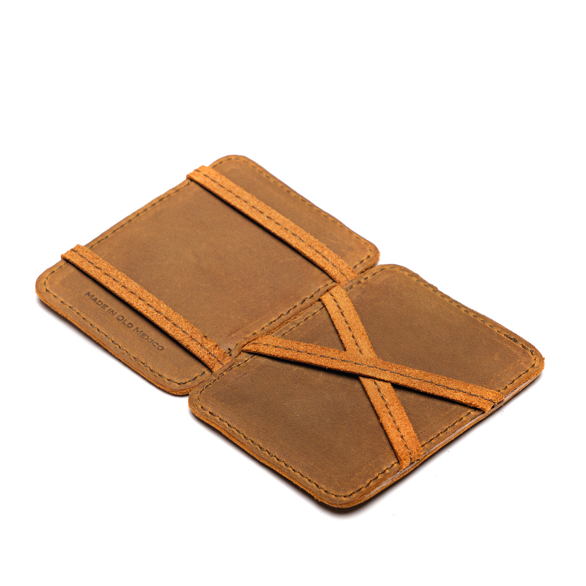 Front Pocket Magic Wallet in Tobacco opened flat to show the crossed leather straps inside