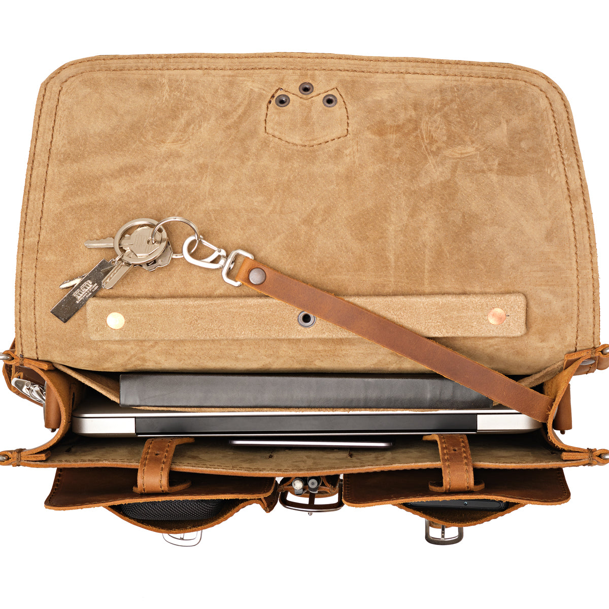 Thin Front Pocket Leather Briefcase in Tobacco, top view open showing a laptop and key leash with keys inside