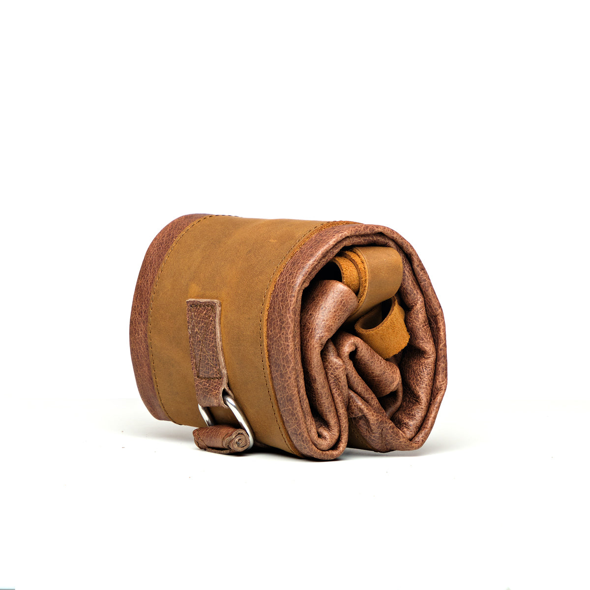 Travel Tote in Burnt Sausage, angled side view rolled up and strapped closed for travel