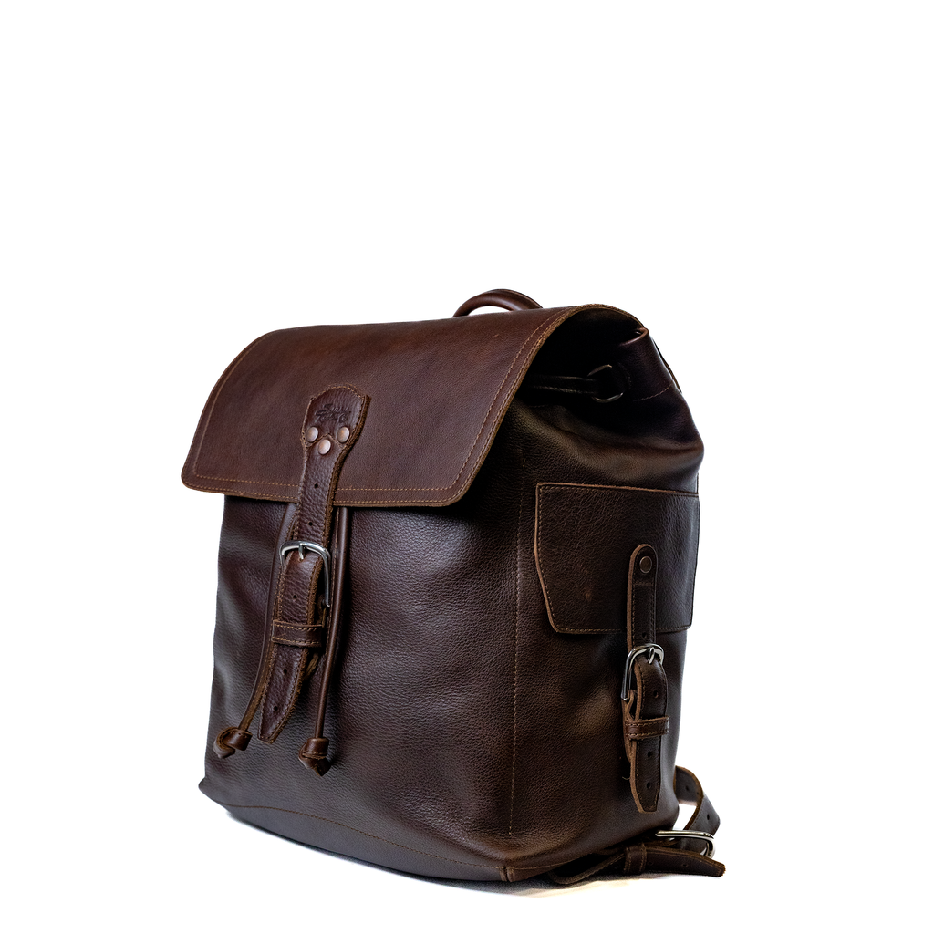 16" Drawstring Backpack in Dark Coffee Brown, angled front view with buckled flap and side pocket
