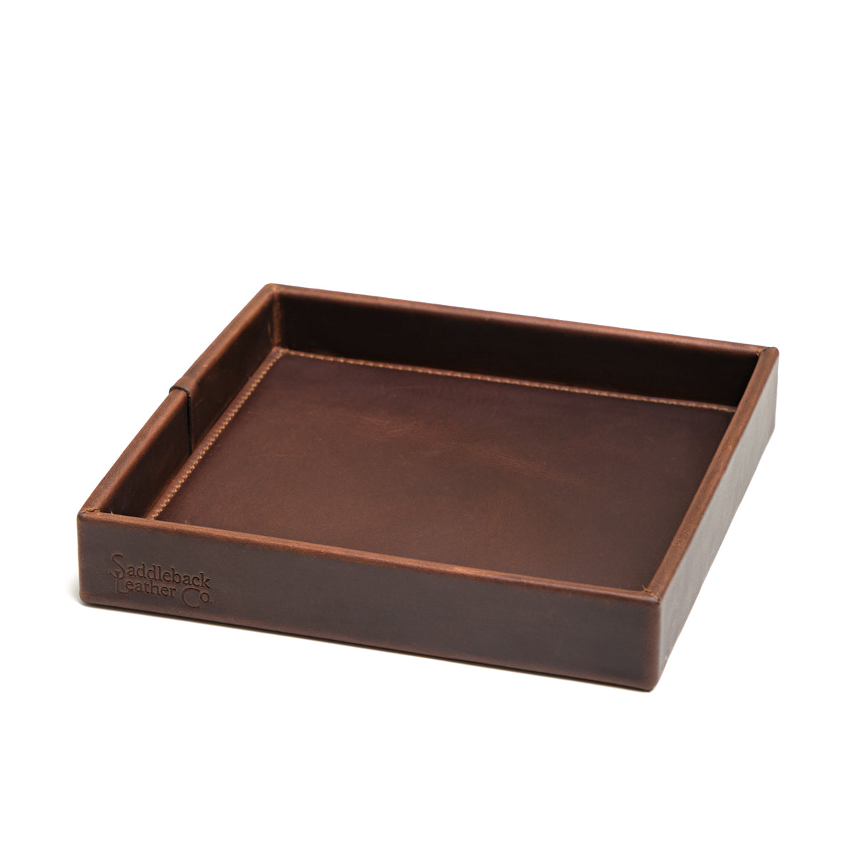 The Simple Leather Valet Tray in Dark Coffee Brown, empty, angled view showing stitched corner seams and embossed logo