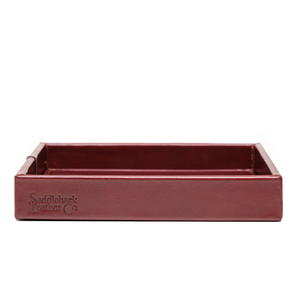 The Simple Leather Valet Tray in Oxblood, straight-on side view showing embossed Saddleback Leather Co. logo