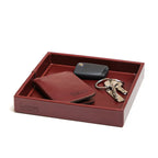 The Simple Leather Valet Tray in Oxblood holding a leather card wallet, key fob and keys, angled view