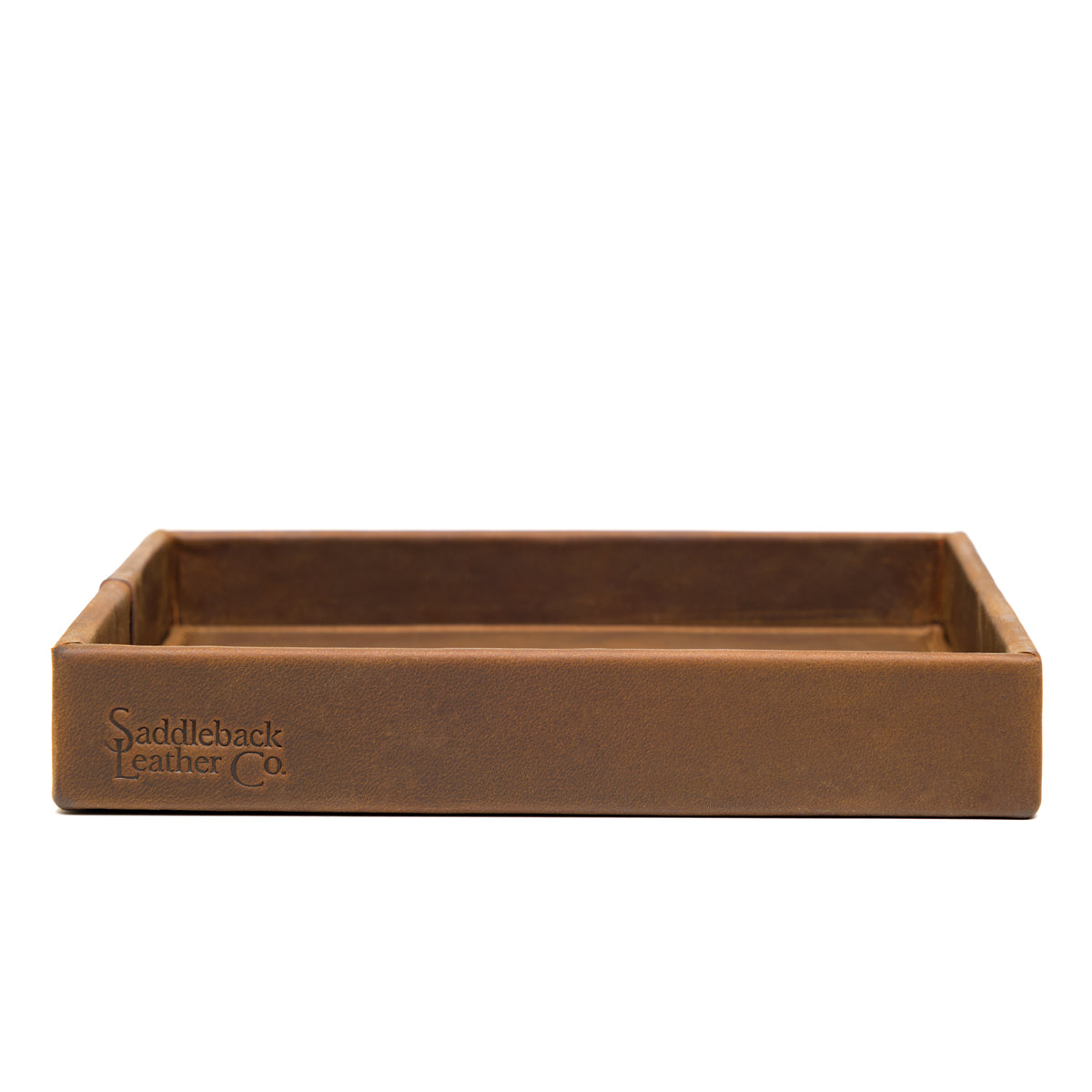The Simple Leather Valet Tray in Tobacco, straight-on side view showing embossed Saddleback Leather Co. logo
